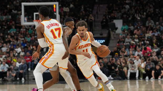 Mar 19, 2023; San Antonio, Texas, USA; Atlanta Hawks guard Trae Young (11) dribbles around a screen from forward Onyeka Okongwu (17) in the second half against the San Antonio Spurs at the AT&T Center. Mandatory Credit: Daniel Dunn-USA TODAY Sports